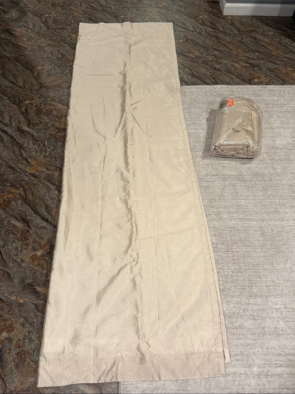 Two 50 x 84 ivory beige curtains. New. Never used